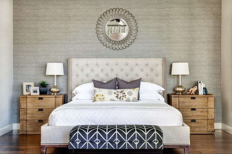 Modern bedroom wallpaper installation with geometric pattern
